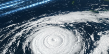 Satellite view of a large hurricane with glowing blue lines connecting landmasses across the globe